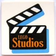 Tile 2 x 2 with Orange 'LEGO Studios' on Black Film Slate Pattern