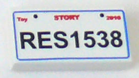 Tile 1 x 2 with 'Toy STORY 2010 RES1538' Pattern