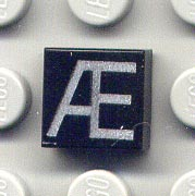 Tile 1 x 1 with Silver Capital Letter Æ Pattern