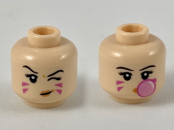 Minifigure, Head Dual Sided Female, Black Eyebrows, Dark Pink Stripes on Cheeks, Left Eye Winking / Blowing Bubblegum Bubble Pattern