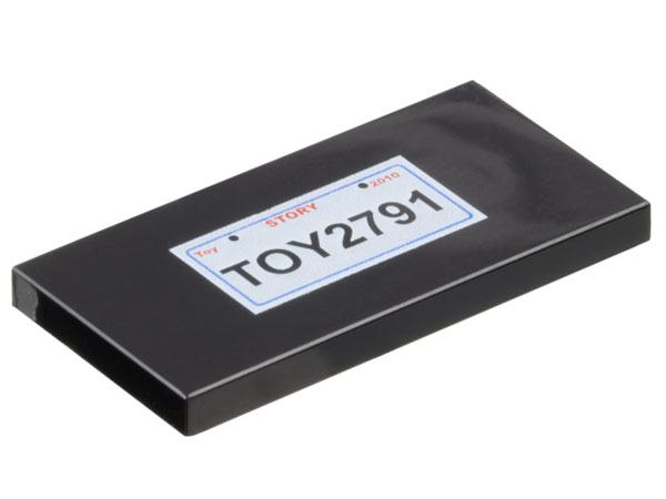 Tile 2 x 4 with 'TOY2791', Red 'Toy STORY 2010', and Blue Rectangle on White Background Pattern