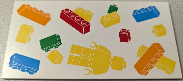 Tile 8 x 16 with Bottom Tubes, Textured Surface with Yellow, Orange, Dark Azure, Red and Bright Green Floating Bricks and Minifigure Pattern