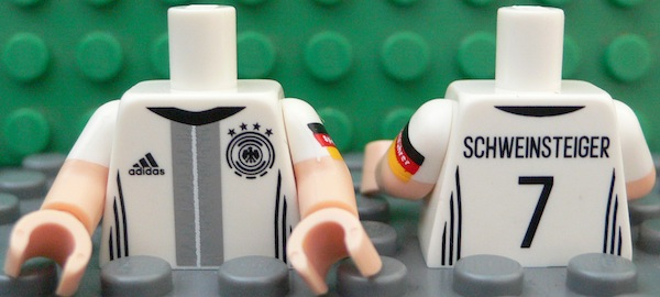 Torso Soccer Shirt with Adidas Logo, 4 Stars and Eagle Front, 'SCHWEINSTEIGER 7' Back Pattern / Light Nougat Arms with Molded White Short Sleeves and Printed German Flag with 'Spielführer' Pattern / Light Nougat Hands